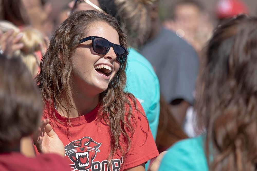 Davenport University Student Enjoying time with classmates on campus